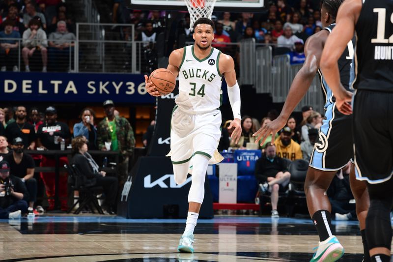 ATLANTA, GA - MARCH 30: Giannis Antetokounmpo #34 of the Milwaukee Bucks dribbles the ball during the game against the Atlanta Hawks on March 30, 2024 at State Farm Arena in Atlanta, Georgia.  NOTE TO USER: User expressly acknowledges and agrees that, by downloading and/or using this Photograph, user is consenting to the terms and conditions of the Getty Images License Agreement. Mandatory Copyright Notice: Copyright 2024 NBAE (Photo by Scott Cunningham/NBAE via Getty Images)