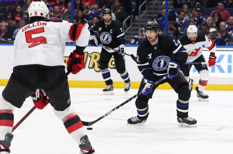 Oct 11, 2025; Tampa, Florida, USA; Tampa Bay Lightning right wing Oliver Bjorkstrand (22) skates with the puck against the New Jersey Devils during the third period at Benchmark International Arena. Mandatory Credit: Kim Klement Neitzel-Imagn Images