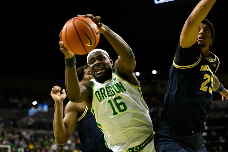 Jan 17, 2026; Eugene, Oregon, USA; Oregon Ducks center Ege Demir (16) grabs a rebound during the second half against the Oregon Ducks at Matthew Knight Arena. Mandatory Credit: Craig Strobeck-Imagn Images
