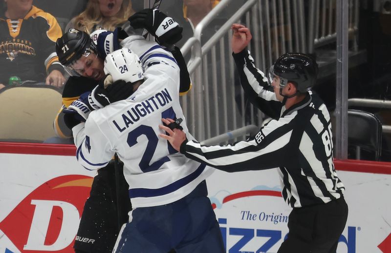 Nov 29, 2025; Pittsburgh, Pennsylvania, USA;  Pittsburgh Penguins center Evgeni Malkin (71) and Toronto Maple Leafs center Scott Laughton (24) scuffle during the third period at PPG Paints Arena. Mandatory Credit: Charles LeClaire-Imagn Images