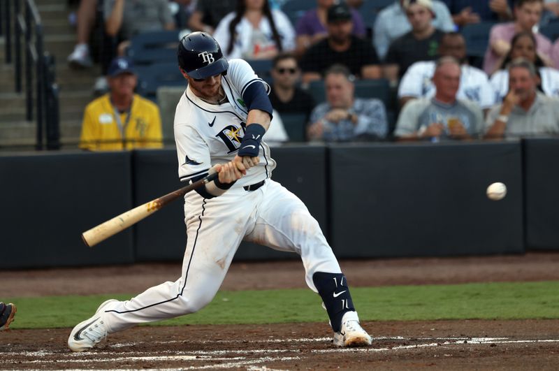 May 20, 2025; St. Petersburg, Florida, USA; Tampa Bay Rays catcher Danny Jansen (19) singles against the Houston Astros during the second inning at George M. Steinbrenner Field. Mandatory Credit: Kim Klement Neitzel-Imagn Images