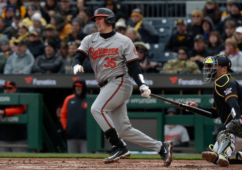 Apr 5, 2024; Pittsburgh, Pennsylvania, USA;  Baltimore Orioles catcher Adley Rutschman (35) hits an RBI single against the Pittsburgh Pirates during the seventh inning at PNC Park. Mandatory Credit: Charles LeClaire-USA TODAY Sports