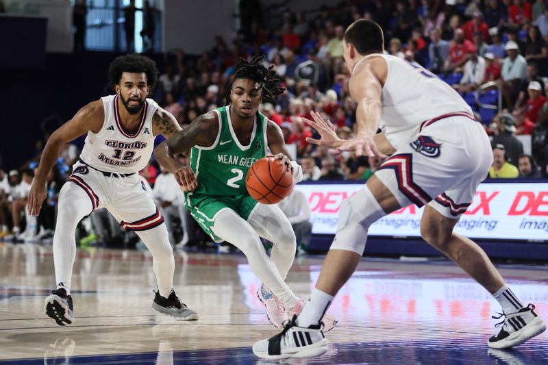 Jan 28, 2024; Boca Raton, Florida, USA; North Texas Mean Green guard Jason Edwards (2) drives to the basket past Florida Atlantic Owls guard Jalen Gaffney (12) during the first half at Eleanor R. Baldwin Arena. Mandatory Credit: Sam Navarro-USA TODAY Sports