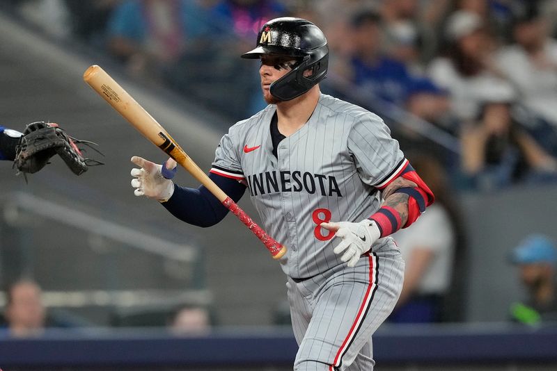 May 10, 2024; Toronto, Ontario, CAN; Minnesota Twins catcher Christian Vazquez (8) tosses his bat after striking out against the Toronto Blue Jays during the second inning at Rogers Centre. Mandatory Credit: John E. Sokolowski-USA TODAY Sports