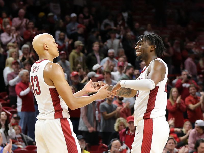 Nov 28, 2022; Fayetteville, Arkansas, USA; Arkansas Razorbacks guard Jordan Walsh (13) and forward Kamani Johnson (20) celebrate in the second half against the Troy Trojans at Bud Walton Arena. Arkansas won 74-61. Mandatory Credit: Nelson Chenault-USA TODAY Sports