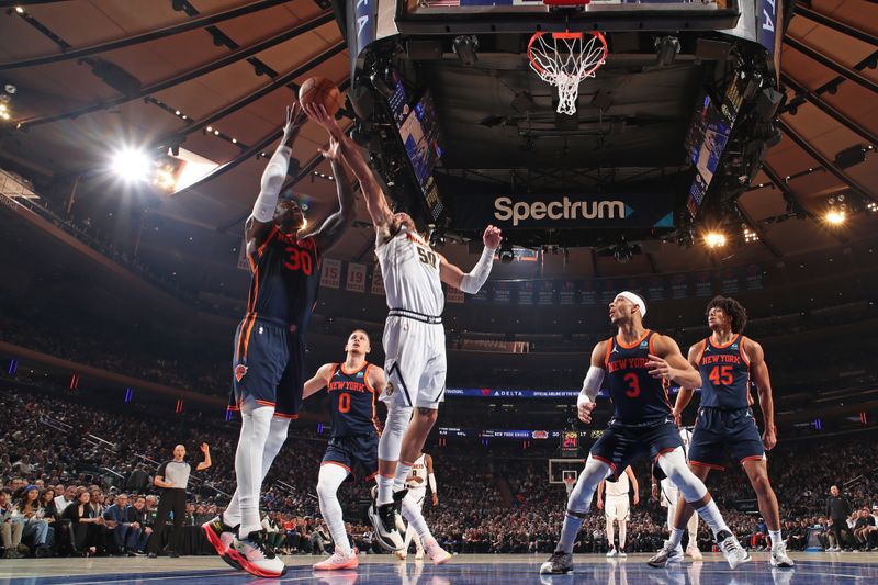 NEW YORK, NY - JANUARY 25: Aaron Gordon #50 of the Denver Nuggets rebounds during the game against the New York Knicks on January 25, 2024 at Madison Square Garden in New York City, New York.  NOTE TO USER: User expressly acknowledges and agrees that, by downloading and or using this photograph, User is consenting to the terms and conditions of the Getty Images License Agreement. Mandatory Copyright Notice: Copyright 2024 NBAE  (Photo by Nathaniel S. Butler/NBAE via Getty Images)