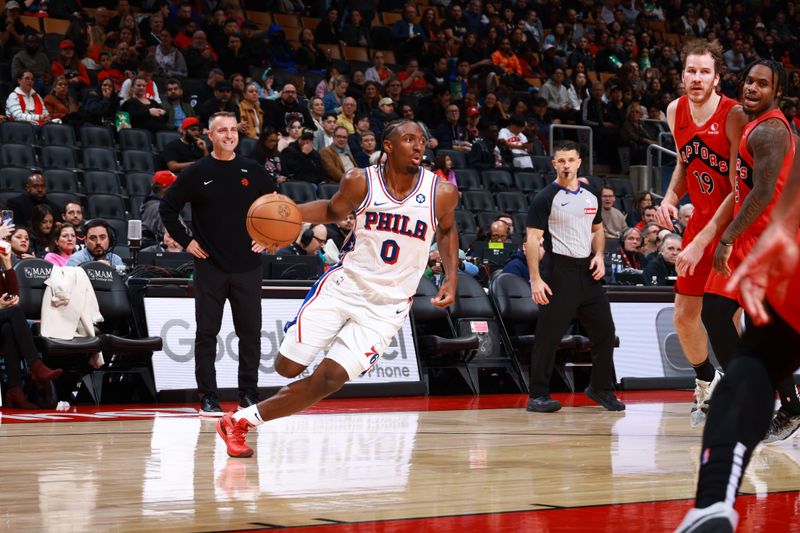 TORONTO, CANADA - OCTOBER 25: Tyrese Maxey #0 of the Philadelphia 76ers handles the ball during the game against the Toronto Raptors on October 25, 2024 at the Scotiabank Arena in Toronto, Ontario, Canada.  NOTE TO USER: User expressly acknowledges and agrees that, by downloading and or using this Photograph, user is consenting to the terms and conditions of the Getty Images License Agreement.  Mandatory Copyright Notice: Copyright 2024 NBAE (Photo by Vaughn Ridley/NBAE via Getty Images)