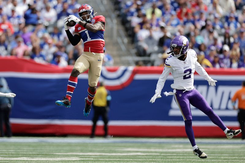 New York Giants wide receiver Malik Nabers (1) catches a pass and Minnesota Vikings cornerback Stephon Gilmore (2) defends during the second half of an NFL football game, Sunday, Sept. 8, 2024, in East Rutherford, N.J. (AP Photo/Adam Hunger)