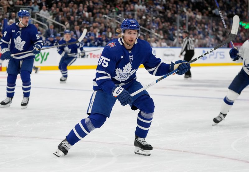 Nov 6, 2023; Toronto, Ontario, CAN; Toronto Maple Leafs defenseman William Lagesson (85) skates against the Tampa Bay Lightning during the second period at Scotiabank Arena. Mandatory Credit: John E. Sokolowski-USA TODAY Sports