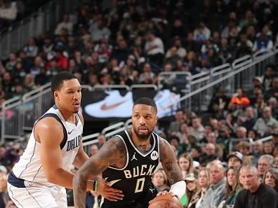 MILWAUKEE, WI - NOVEMBER 18: Damian Lillard #0 of the Milwaukee Bucks dribbles the ball during the game against the Dallas Mavericks on November 18, 2023 at the Fiserv Forum Center in Milwaukee, Wisconsin. NOTE TO USER: User expressly acknowledges and agrees that, by downloading and or using this Photograph, user is consenting to the terms and conditions of the Getty Images License Agreement. Mandatory Copyright Notice: Copyright 2023 NBAE (Photo by Gary Dineen/NBAE via Getty Images).