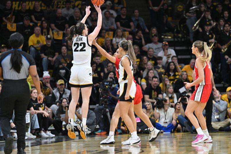 Mar 3, 2024; Iowa City, Iowa, USA; Iowa Hawkeyes guard Caitlin Clark (22) shoots a three point basket as guard Gabbie Marshall (24) looks on during the first quarter against the Ohio State Buckeyes at Carver-Hawkeye Arena. Mandatory Credit: Jeffrey Becker-USA TODAY Sports