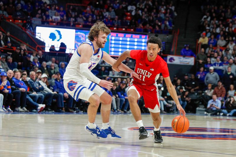 Jan 16, 2024; Boise, Idaho, USA; UNLV Rebels guard Dedan Thomas Jr. (11) during the first half against the Boise State Broncos at ExtraMile Arena. Mandatory Credit: Brian Losness-USA TODAY Sports

