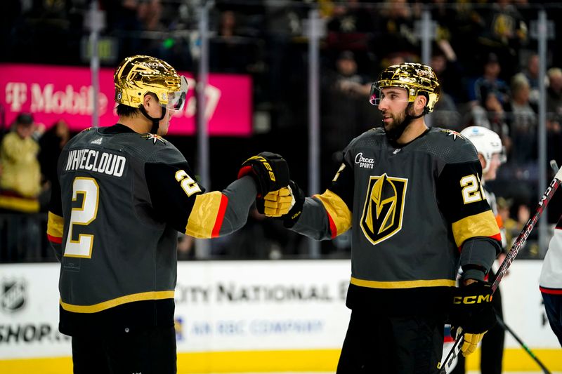 Mar 19, 2023; Las Vegas, Nevada, USA; Vegas Golden Knights defenseman Zach Whitecloud (2) celebrates with center Michael Amadio (22) after scoring against the Columbus Blue Jackets during the second period at T-Mobile Arena. Mandatory Credit: Lucas Peltier-USA TODAY Sports