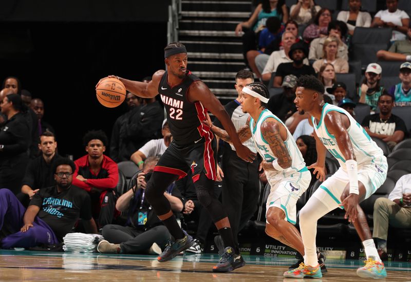 CHARLOTTE, NC - OCTOBER 8: Jimmy Butler #22 of the Miami Heat looks to pass the ball during the game against the Charlotte Hornets during a preseason game on October 8, 2024 at Spectrum Center in Charlotte, North Carolina. NOTE TO USER: User expressly acknowledges and agrees that, by downloading and or using this photograph, User is consenting to the terms and conditions of the Getty Images License Agreement. Mandatory Copyright Notice: Copyright 2024 NBAE (Photo by Kent Smith/NBAE via Getty Images)