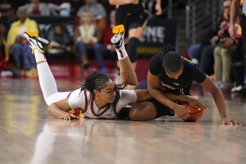 Dec 29, 2024; Los Angeles, California, USA; Southern California Trojans guard Kennedy Smith (11) and Michigan Wolverines guard Mila Holloway (3) battle for the ball in the first half at Galen Center. Mandatory Credit: Kirby Lee-Imagn Images