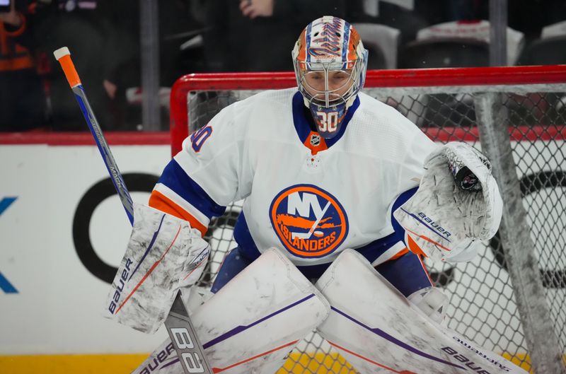 Apr 22, 2024; Raleigh, North Carolina, USA; New York Islanders goaltender Ilya Sorokin (30) watches the shot during the warmups before the game against the Carolina Hurricanes in game two of the first round of the 2024 Stanley Cup Playoffs at PNC Arena. Mandatory Credit: James Guillory-USA TODAY Sports