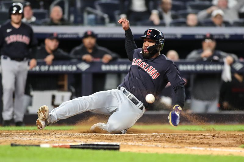 May 1, 2023; Bronx, New York, USA;  Cleveland Guardians shortstop Amed Rosario (1) scores the tying the run in the ninth inning against the New York Yankees at Yankee Stadium. Mandatory Credit: Wendell Cruz-USA TODAY Sports