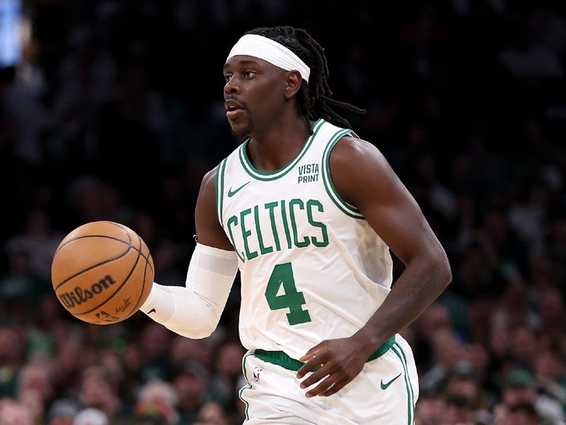 BOSTON, MASSACHUSETTS - JANUARY 05: Jrue Holiday #4 of the Boston Celtics dribbles downcourt during the second quarter against the Utah Jazz at TD Garden on January 05, 2024 in Boston, Massachusetts. NOTE TO USER: User expressly acknowledges and agrees that, by downloading and or using this photograph, user is consenting to the terms and conditions of the Getty Images License Agreement.  (Photo by Maddie Meyer/Getty Images)