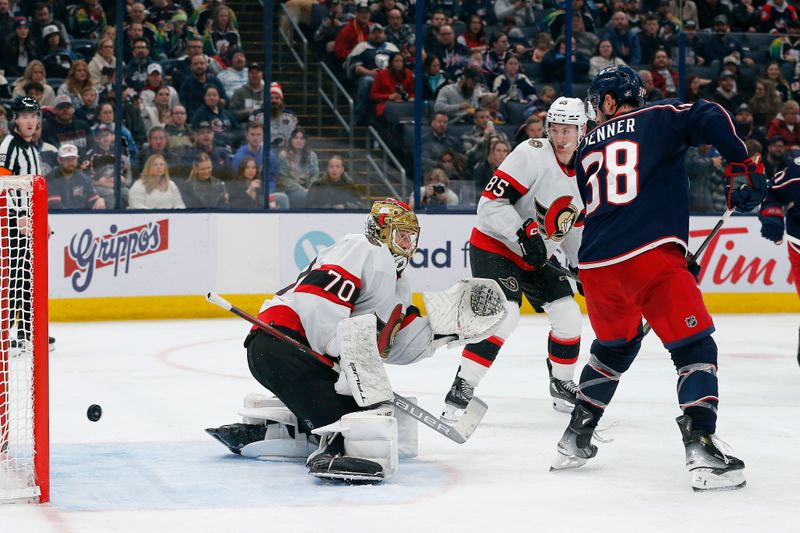 Dec 1, 2023; Columbus, Ohio, USA; Columbus Blue Jackets center Boone Jenner (38) tips the puck past Ottawa Senators goalie Joonas Korpisalo (70) for a goal during the second period at Nationwide Arena. Mandatory Credit: Russell LaBounty-USA TODAY Sports