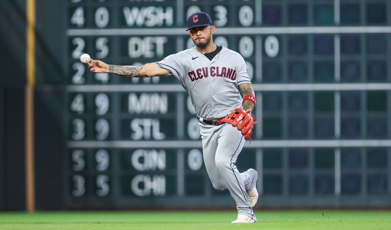 Aug 1, 2023; Houston, Texas, USA; Cleveland Guardians shortstop Gabriel Arias (13) throws out a runner at first base during the first inning against the Houston Astros at Minute Maid Park. Mandatory Credit: Troy Taormina-USA TODAY Sports