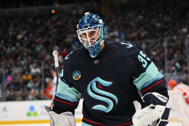 Nov 27, 2024; Seattle, Washington, USA; Seattle Kraken goaltender Joey Daccord (35) reacts to an Anaheim Ducks goal during the second period at Climate Pledge Arena. Mandatory Credit: Steven Bisig-Imagn Images