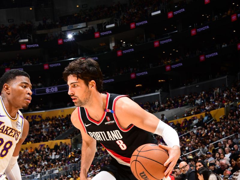 LOS ANGELES, CA - DECEMBER 8: Deni Avdija #8 of the Portland Trail Blazers drives to the basket during the game against the Los Angeles Lakers on December 8, 2024 at Crypto.Com Arena in Los Angeles, California. NOTE TO USER: User expressly acknowledges and agrees that, by downloading and/or using this Photograph, user is consenting to the terms and conditions of the Getty Images License Agreement. Mandatory Copyright Notice: Copyright 2024 NBAE (Photo by Adam Pantozzi/NBAE via Getty Images)