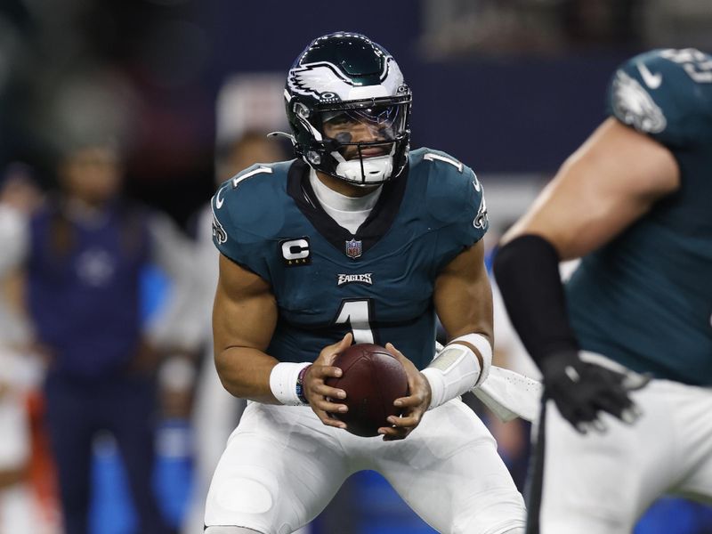 Philadelphia Eagles quarterback Jalen Hurts (1) during the first half of an NFL football game against the Dallas Cowboys, Sunday, Dec. 10, 2023, in Arlington, Texas. (AP Photo/Matt Patterson)