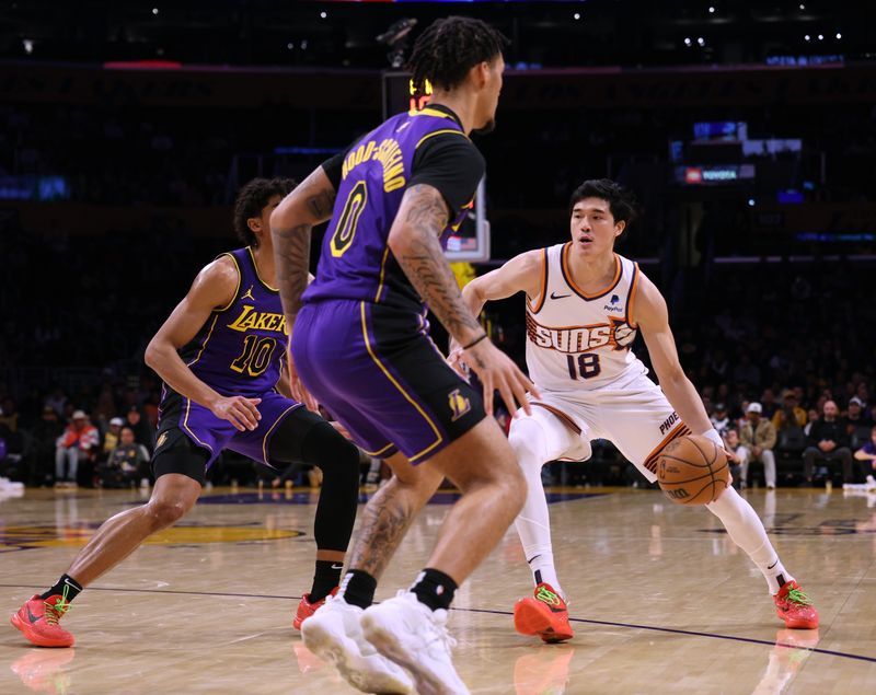 LOS ANGELES, CALIFORNIA - JANUARY 11: Yuta Watanabe #18 of the Phoenix Suns dribbles in front of Max Christie #10 and Jalen Hood-Schifino #0 of the Los Angeles Lakers at Crypto.com Arena on January 11, 2024 in Los Angeles, California. User is consenting to the terms and conditions of the Getty Images License Agreement.  (Photo by Harry How/Getty Images)