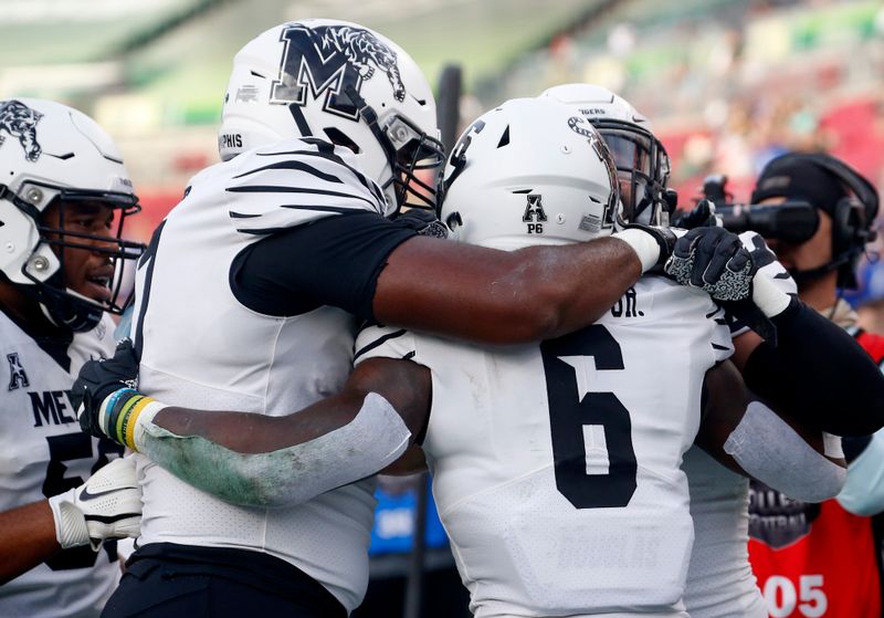 Nov 23, 2019; Tampa, FL, USA; Memphis Tigers running back Patrick Taylor Jr. (6) celebrates a touchdown run against the South Florida Bulls during the first quarter at Raymond James Stadium. Mandatory Credit: Reinhold Matay-USA TODAY Sports