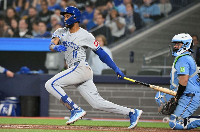 Apr 30, 2024; Toronto, Ontario, CAN;  Kansas City Royals third baseman Maikel Garcia (11) hits a single against the Toronto Blue Jays in the eighth inning at Rogers Centre. Mandatory Credit: Dan Hamilton-USA TODAY Sports