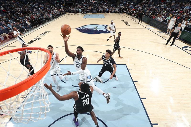 MEMPHIS, TN - February 26:  Jaren Jackson Jr. #13 of the Memphis Grizzlies drives to the basket during the game against the Brooklyn Nets on February 26, 2024 at FedExForum in Memphis, Tennessee. NOTE TO USER: User expressly acknowledges and agrees that, by downloading and or using this photograph, User is consenting to the terms and conditions of the Getty Images License Agreement. Mandatory Copyright Notice: Copyright 2024 NBAE (Photo by Joe Murphy/NBAE via Getty Images)