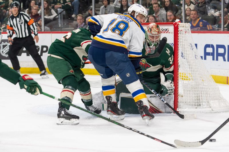 Apr 8, 2023; Saint Paul, Minnesota, USA; St. Louis Blues center Robert Thomas (18) crashes the net as Minnesota Wild goaltender Filip Gustavsson (32) defends in the third period at Xcel Energy Center. Mandatory Credit: Matt Blewett-USA TODAY Sports