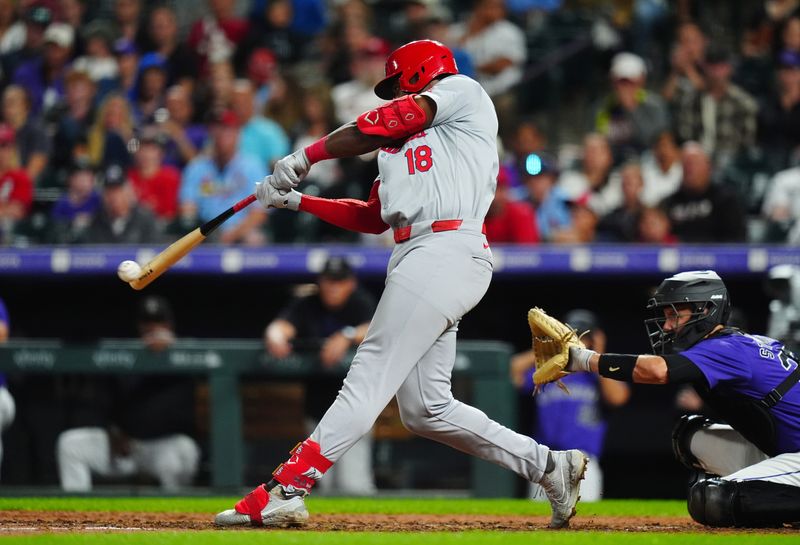 Sep 24, 2024; Denver, Colorado, USA; St. Louis Cardinals right fielder Jordan Walker (18) hit an RBI single in the eighth inning against the Colorado Rockies at Coors Field. Mandatory Credit: Ron Chenoy-Imagn Images