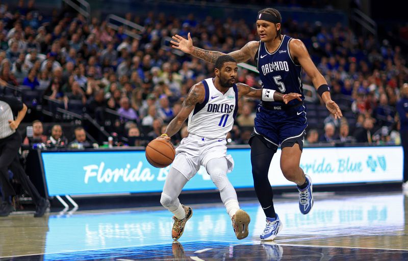 ORLANDO, FLORIDA - NOVEMBER 06: Kyrie Irving #11 of the Dallas Mavericks drives to the basket during a game against the Orlando Magic at Amway Center on November 06, 2023 in Orlando, Florida. (Photo by Mike Ehrmann/Getty Images) NOTE TO USER: User expressly acknowledges and agrees that, by downloading and or using this photograph, User is consenting to the terms and conditions of the Getty Images License Agreement. (Photo by Mike Ehrmann/Getty Images)