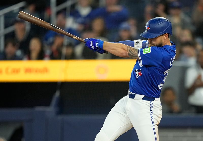 May 22, 2025; Toronto, Ontario, CAN; Toronto Blue Jays right fielder Nathan Lukes (38) hits a  walk off single during the eleventh inning against the San Diego Padres at Rogers Centre. Mandatory Credit: John E. Sokolowski-Imagn Images