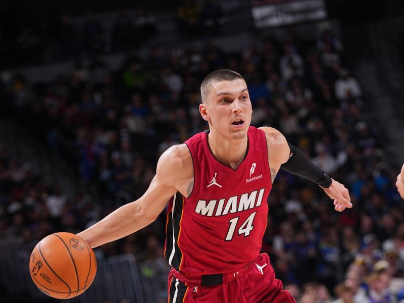 DENVER, CO - NOVEMBER 8: Tyler Herro #14 of the Miami Heat dribbles the ball during the game against the Denver Nuggets on November 8, 2024 at Ball Arena in Denver, Colorado. NOTE TO USER: User expressly acknowledges and agrees that, by downloading and/or using this Photograph, user is consenting to the terms and conditions of the Getty Images License Agreement. Mandatory Copyright Notice: Copyright 2024 NBAE (Photo by Bart Young/NBAE via Getty Images)