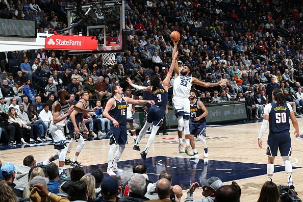 MINNEAPOLIS, MN -  NOVEMBER 1: Karl-Anthony Towns #32 of the Minnesota Timberwolves drives to the basket during the game against the Denver Nuggets on November 1, 2023 at Target Center in Minneapolis, Minnesota. NOTE TO USER: User expressly acknowledges and agrees that, by downloading and or using this Photograph, user is consenting to the terms and conditions of the Getty Images License Agreement. Mandatory Copyright Notice: Copyright 2023 NBAE (Photo by David Sherman/NBAE via Getty Images)
