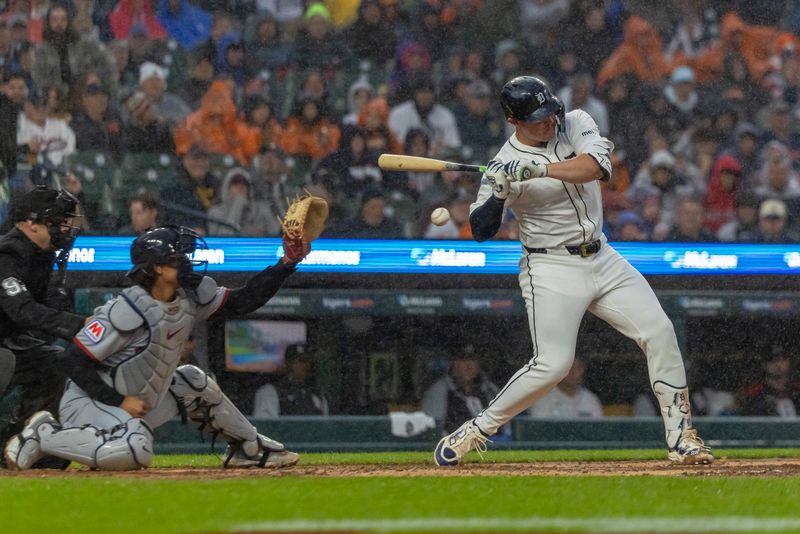 May 22, 2025; Detroit, Michigan, USA; Detroit Tigers first base Spencer Torkelson (20) takes a high inside pitch from Cleveland Guardians pitcher Tanner Bibee (28) for a walk in the fourth inning at Comerica Park. Mandatory Credit: David Reginek-Imagn Images