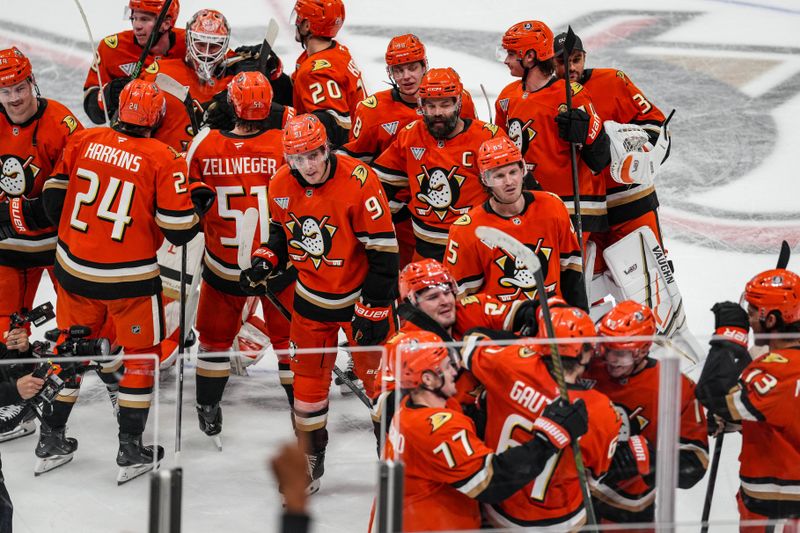 Nov 22, 2025; Anaheim, California, USA;  Anaheim Ducks celebrate their overtime win against Vegas Golden Knights at Honda Center. Mandatory Credit: Corinne Votaw-Imagn Images