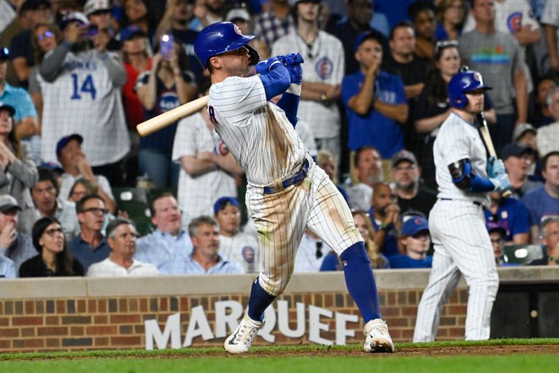 Jul 19, 2023; Chicago, Illinois, USA;  Chicago Cubs second baseman Nico Hoerner (2) his a grand slam against the Washington Nationals during the eighth inning at Wrigley Field. Mandatory Credit: Matt Marton-USA TODAY Sports