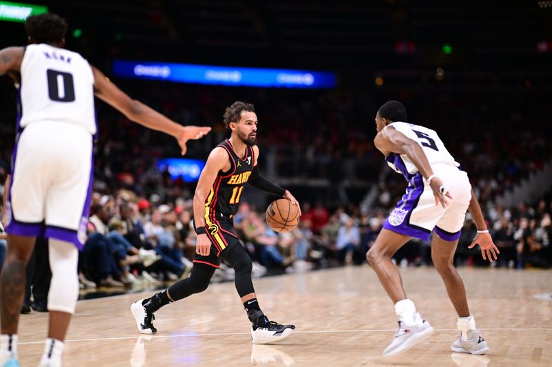 ATLANTA, GA - NOVEMBER 1: Trae Young #11 of the Atlanta Hawks handles the ball during the game against the Sacramento Kings on November 1, 2024 at State Farm Arena in Atlanta, Georgia.  NOTE TO USER: User expressly acknowledges and agrees that, by downloading and/or using this Photograph, user is consenting to the terms and conditions of the Getty Images License Agreement. Mandatory Copyright Notice: Copyright 2024 NBAE (Photo by Adam Hagy/NBAE via Getty Images)