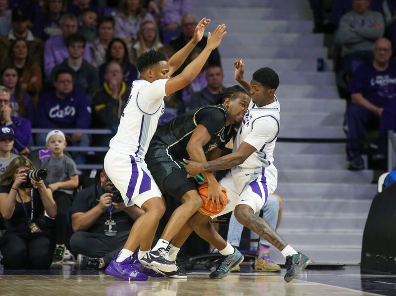 Jan 6, 2024; Manhattan, Kansas, USA; UCF Knights guard Shemarri Allen (2) tries to keep the ball from Kansas State Wildcats guards Cam Carter (5) and Tylor Perry (2) during the first half at Bramlage Coliseum. Mandatory Credit: Scott Sewell-USA TODAY Sports