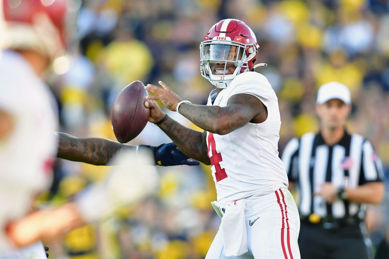 Jan 1, 2024; Pasadena, CA, USA; Alabama Crimson Tide quarterback Jalen Milroe (4) looks to pass in the second quarter against the Michigan Wolverines in the 2024 Rose Bowl college football playoff semifinal game at Rose Bowl. Mandatory Credit: Gary A. Vasquez-USA TODAY Sports