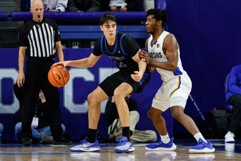 Jan 13, 2024; Colorado Springs, Colorado, USA; Air Force Falcons forward Beau Becker (14) controls the ball as San Jose State Spartans guard Latrell Davis (6) guards in the first half at Clune Arena. Mandatory Credit: Isaiah J. Downing-USA TODAY Sports