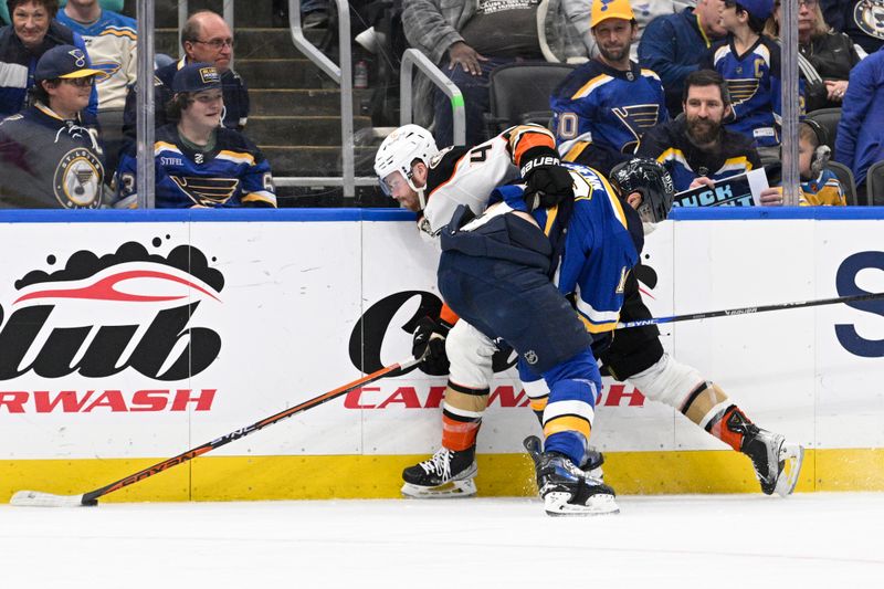 Mar 17, 2024; St. Louis, Missouri, USA; St. Louis Blues center Brayden Schenn (10) checks Anaheim Ducks left wing Max Jones (49) during the third period at Enterprise Center. Mandatory Credit: Jeff Le-USA TODAY Sports