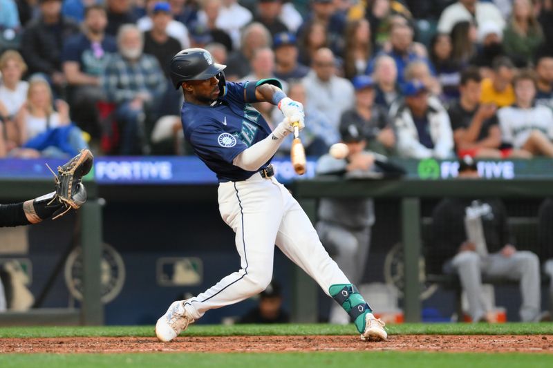 Jun 10, 2024; Seattle, Washington, USA; Seattle Mariners second baseman Ryan Bliss (1) hits a single against the Chicago White Sox during the eighth inning at T-Mobile Park. Mandatory Credit: Steven Bisig-USA TODAY Sports