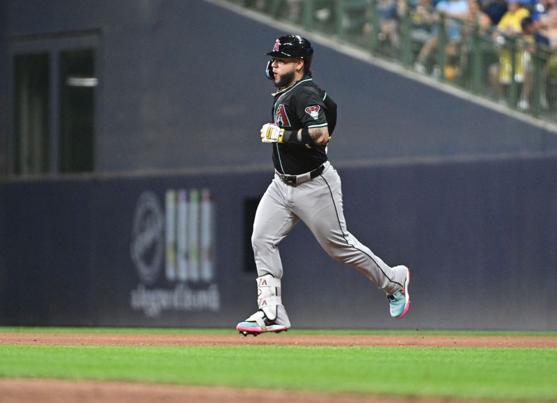 Sep 21, 2024; Milwaukee, Wisconsin, USA; Arizona Diamondbacks catcher Jose Herrera (11) runs around the bases after hitting home run against the Milwaukee Brewers in the fifth inning  at American Family Field. Mandatory Credit: Michael McLoone-Imagn Images