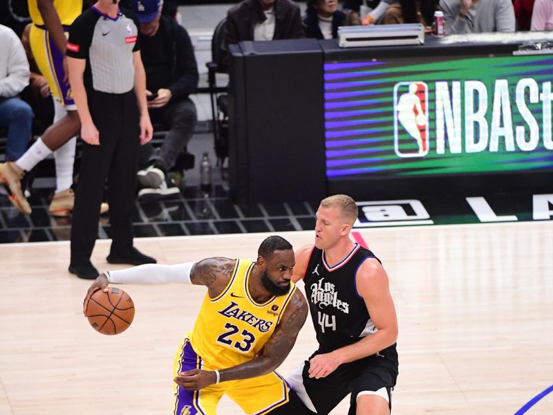 LOS ANGELES, CA - FEBRUARY 28:  LeBron James #23 of the Los Angeles Lakers handles the ball during the game  on February 28, 2024 at Crypto.Com Arena in Los Angeles, California. NOTE TO USER: User expressly acknowledges and agrees that, by downloading and/or using this Photograph, user is consenting to the terms and conditions of the Getty Images License Agreement. Mandatory Copyright Notice: Copyright 2024 NBAE (Photo by Adam Pantozzi/NBAE via Getty Images)