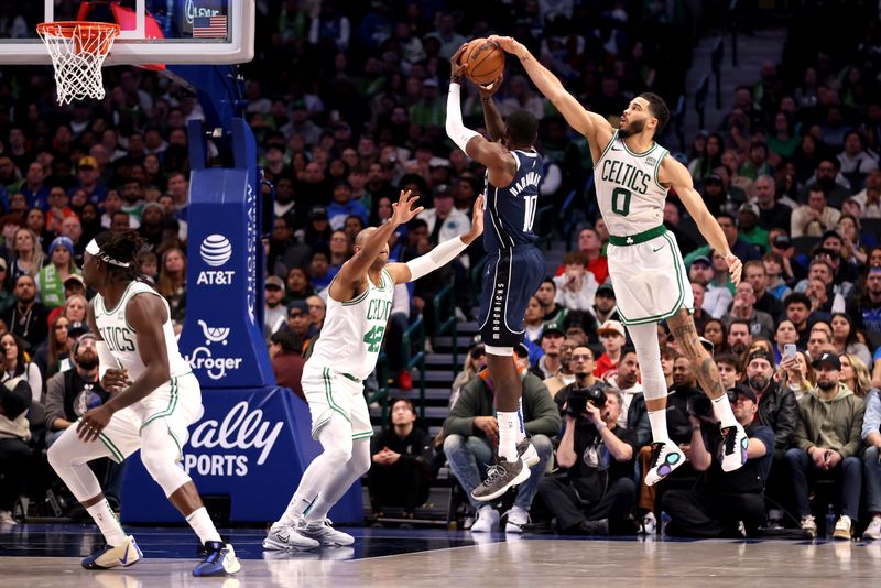 DALLAS, TEXAS - JANUARY 22: Jayson Tatum #0 of the Boston Celtics blocks the shot of Tim Hardaway Jr. #10 of the Dallas Mavericks in the second half at American Airlines Center on January 22, 2024 in Dallas, Texas. NOTE TO USER: User expressly acknowledges and agrees that, by downloading and or using this photograph, User is consenting to the terms and conditions of the Getty Images License Agreement. (Photo by Tim Heitman/Getty Images)