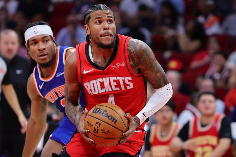 HOUSTON, TEXAS - NOVEMBER 04: Jalen Green #4 of the Houston Rockets works against Miles McBride #2 of the New York Knicks during the second half at Toyota Center on November 04, 2024 in Houston, Texas. NOTE TO USER: User expressly acknowledges and agrees that, by downloading and or using this photograph, User is consenting to the terms and conditions of the Getty Images License Agreement.  (Photo by Alex Slitz/Getty Images)